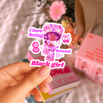 Kawaii Black Girl Sticker - Waterproof Vinyl Decor held by hand with sparkles, perfect for gifting, journaling, or decorating water bottles.