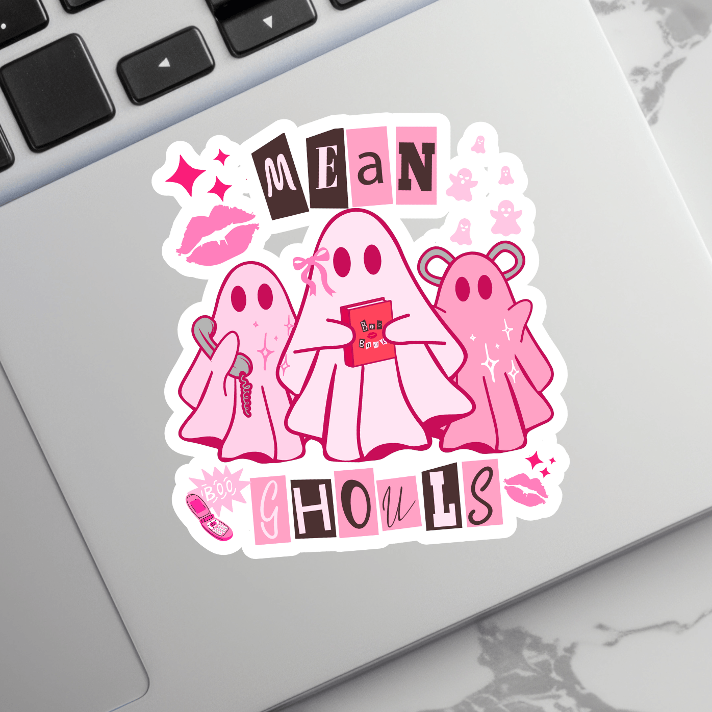 Mean Girls Pink Ghost Sticker on laptop, featuring three cute pink ghosts with accessories. Waterproof vinyl for laptops and tech gear.